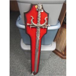 Large sword on wood holder to mount on wall