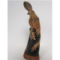 Carved bird on wood base-could be horn