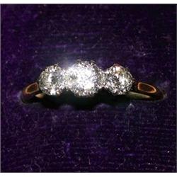 An 18ct gold diamond set ring with three m...