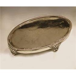A George III silver teapot stand by Jonath...