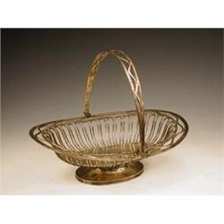 An Edwardian silver cake basket in the lat...