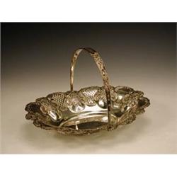 An Edwardian silver cake basket by W Aitke...