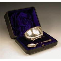 An Edwardian silver porringer and spoon by...