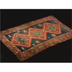 A Kazakh wool rug, the central midnight bl...