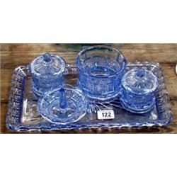 A 1920's blue glass dressing table set. A 1920's blue glass dressing table set.