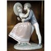 Image 1 : A Lladro figure of a boy and girl kissing, 10