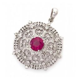 An 18 Karat White Gold Ruby and Diamond Pendant