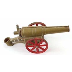 Antique cast iron toy canon marked "Big Bang Canon" with most original paint remaining, 9" long.