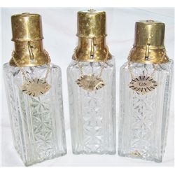 Three Vintage Glass Decanters with Brass-Pump Spouts.
