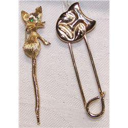Two Pins from the Louis Armstrong  Estate Jewelry Collection.