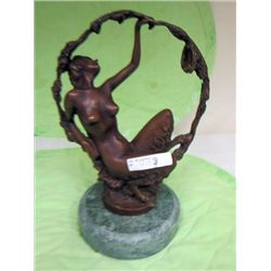 Bronze statue on marble stone