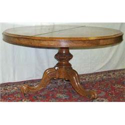 Victorian walnut circular tilt-top dining table
