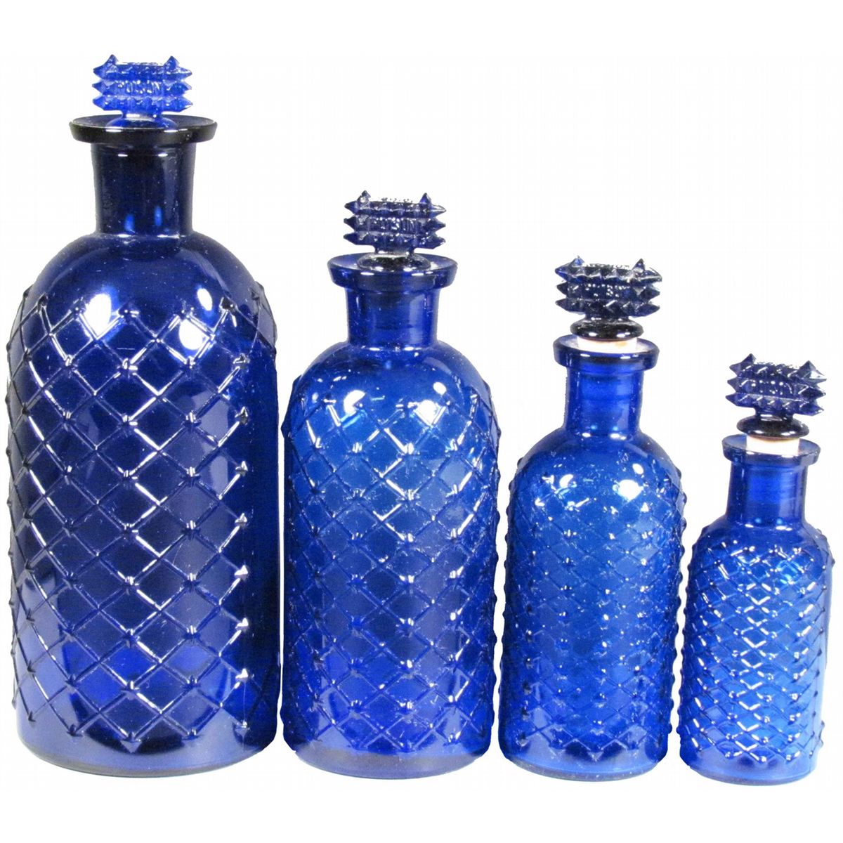 Four Cobalt Blue Embossed Poison Bottles