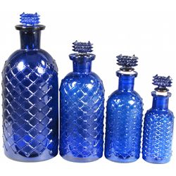 Four Cobalt Blue Embossed Poison Bottles