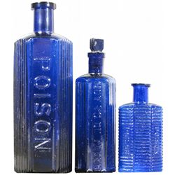 Three Cobalt Blue Embossed Poison Bottles