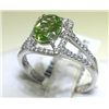 Image 1 : Peridot and .27 Carat Diamonds 18K White Gold Ring