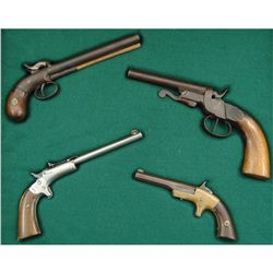 Case Display of 4 Antique Pistols