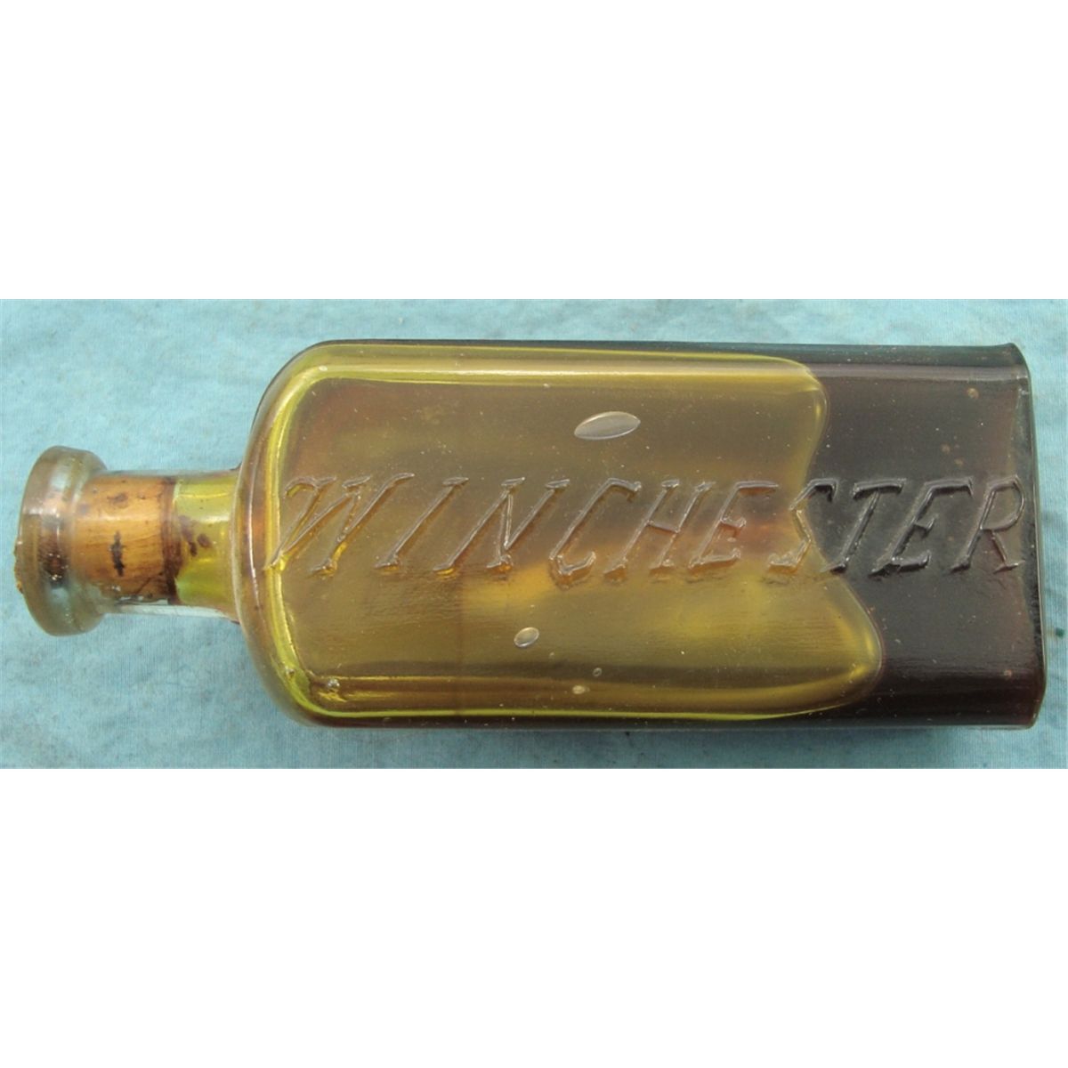 Early Embossed Winchester Gun Oil Bottle