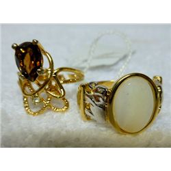 2 Gold tone rings - with stones
