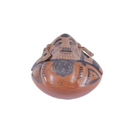 Casa Grande Figural Pot Wearing Earrings