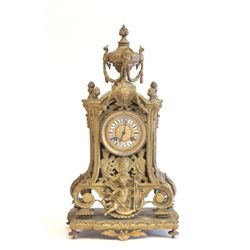 Bronze cherub figural clock with acorn finials