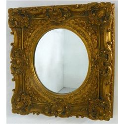 Gilt framed oval mirror