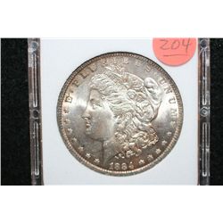 1884-O Silver Morgan $1, MCPCG Graded MS62