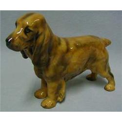 A golden Cocker Spaniel, HN 1187, height 13c