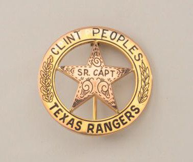 Gold Texas Ranger's badge made from coin with name