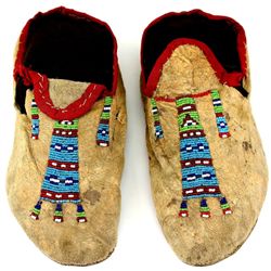 C. 1890's Northern Plains moccasins with beaded geometric pattern tops, openings red trim cloth, ori