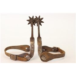 Pair unmarked spurs with 3" long arrow shanks with 8 point rowels, buttons heart and diamond shapes,