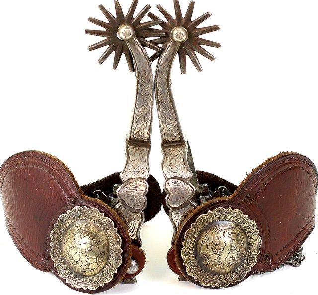 Pair of Mike Morales heart pattern long shank spurs single mounted with