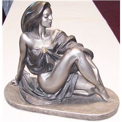 A. Daniel Austin Prod Lady Statue.