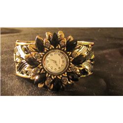 black and gold round watch cuff bracelet