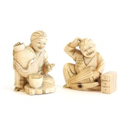2 bone Buddha figures