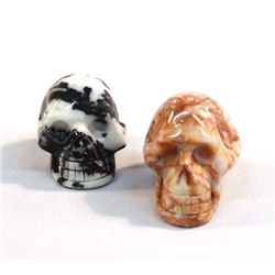 Two Carved Stone Skulls