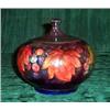 Image 1 : A Moorcroft flambe "Leaf & Berry" lidded bowl...