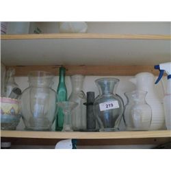 SHELF OF FLOWER VASES