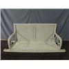 Image 1 : White wicker porch swing.