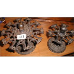 Two C19th cast iron revolving stamp stands...