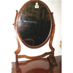 A C19th mahogany oval swing mirror...