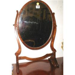 A C19th mahogany oval swing mirror...