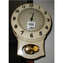 A c1930's enamel tin Smiths wall clock in ...