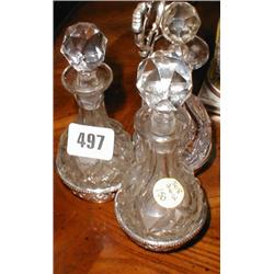 A c1900 silver plated three bottle glass c...