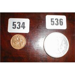 An 1886 silver one dollar coin...