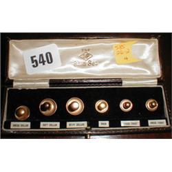 A late C19th boxed gold collar stud set...