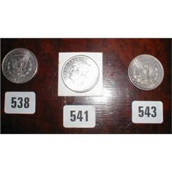 An uncirculated silver one dollar coin 188...
