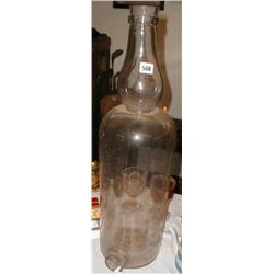 A large C19th glass spirit bottle with tap...