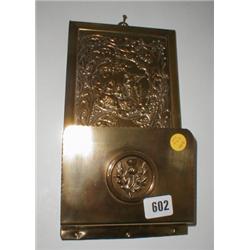 A c1920's brass wall mounted letter rack w...