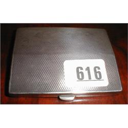A silver cigarette case...